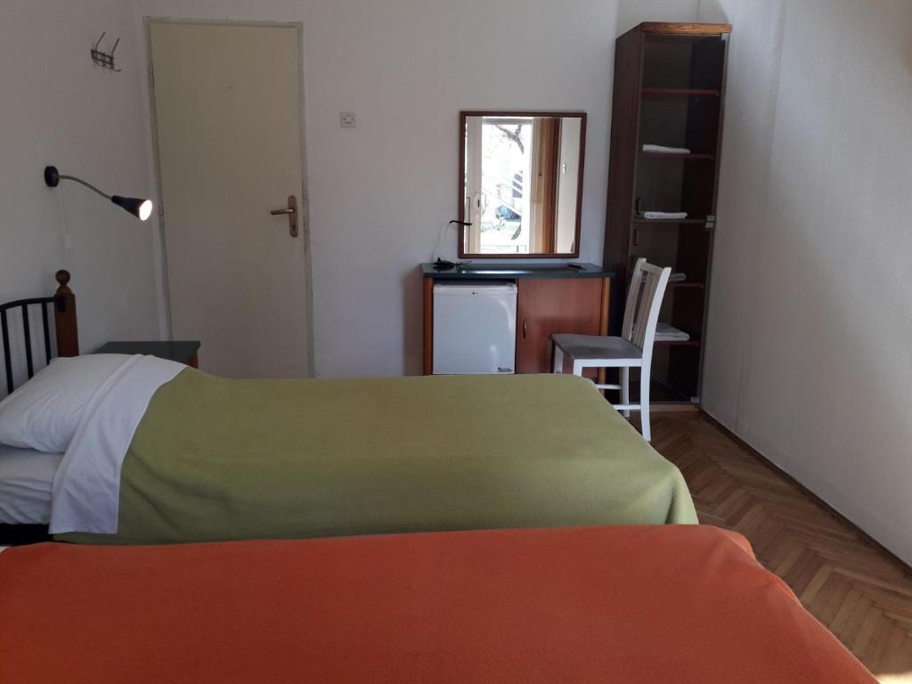 Postel nebo postele na pokoji v ubytování Basil Apartments and Rooms