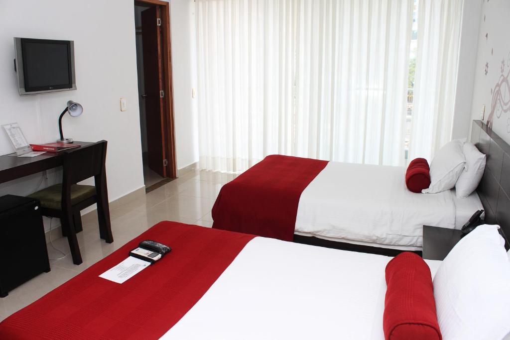 Postel nebo postele na pokoji v ubytování Hotel Florencia Plaza