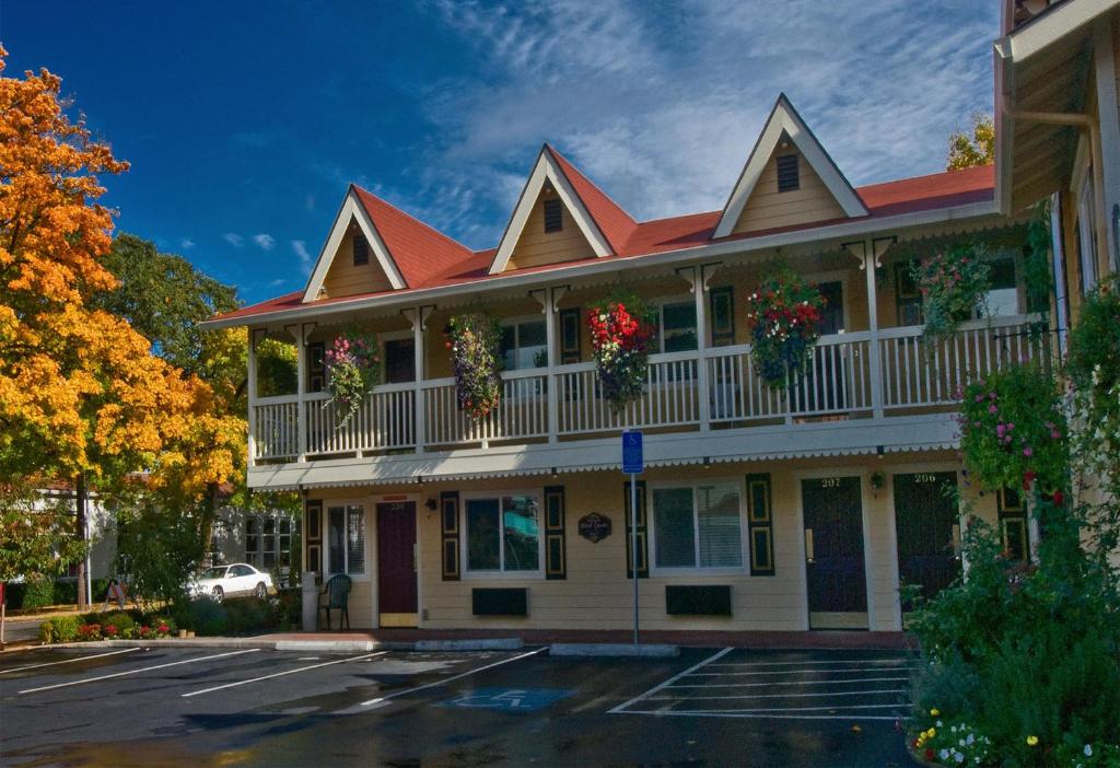 a building with flower baskets on the balconies at Silverton Inn & Suites in Silverton