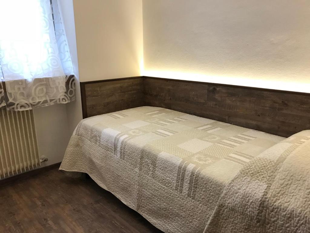 Postel nebo postele na pokoji v ubytování Le Servite Apartments