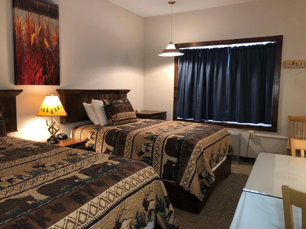 Postel nebo postele na pokoji v ubytování Tug Hill Resort