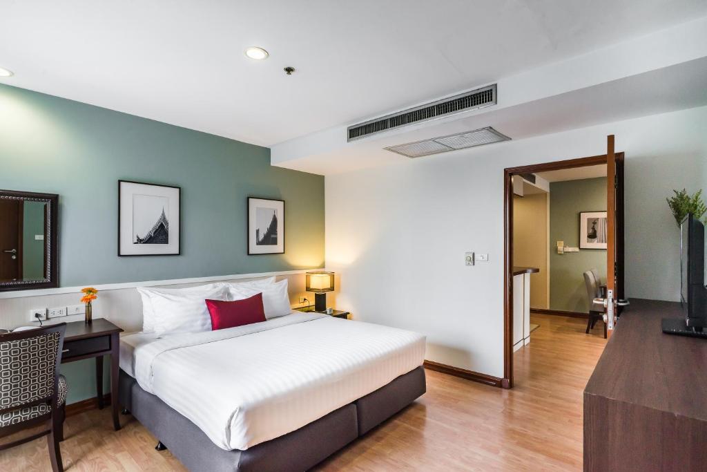 เตียงในห้องที่ Evergreen Place Siam by UHG