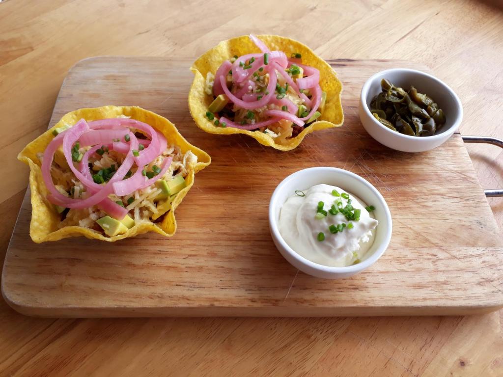 three tacos on a wooden cutting board with dips at Sara Resort in Koh Rong Sanloem