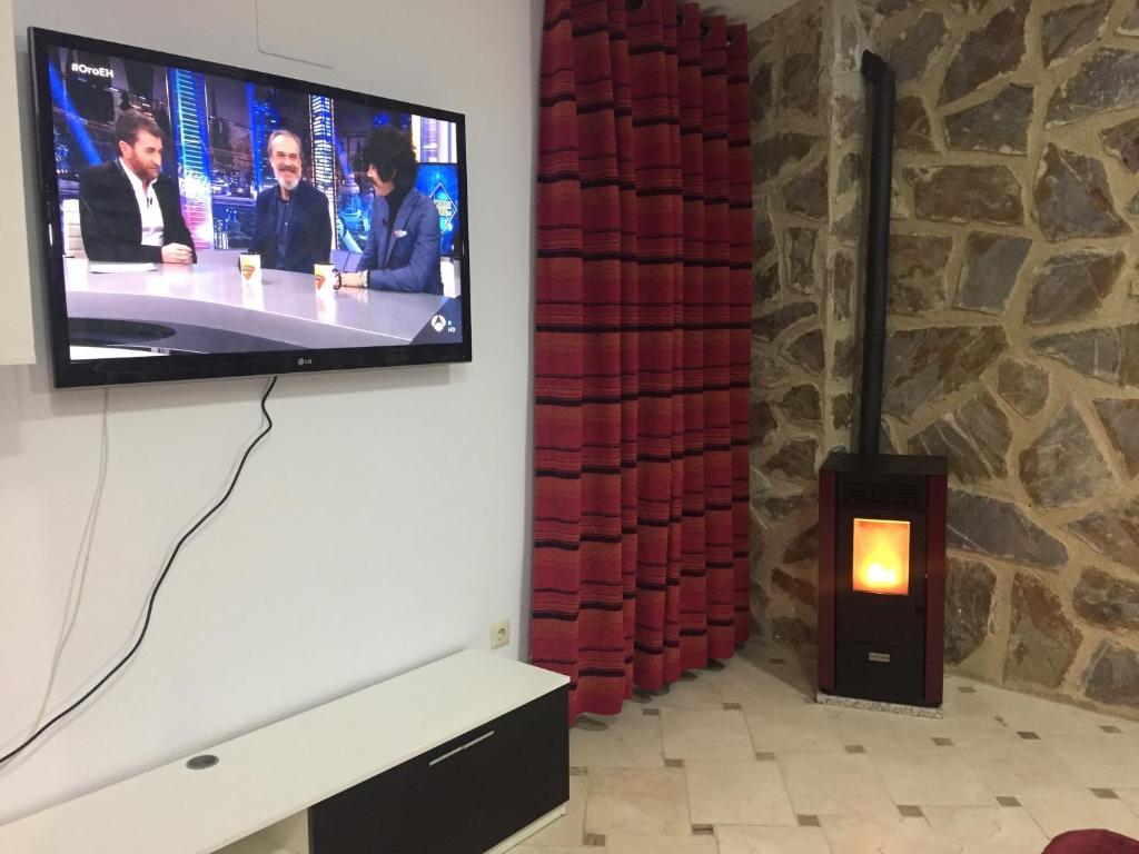 Televisyen dan/atau pusat hiburan di Apartamento Arco del Cristo