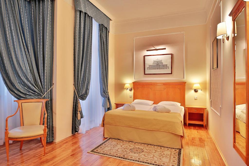 Posteľ alebo postele v izbe v ubytovaní Belvedere Wellness Hotel