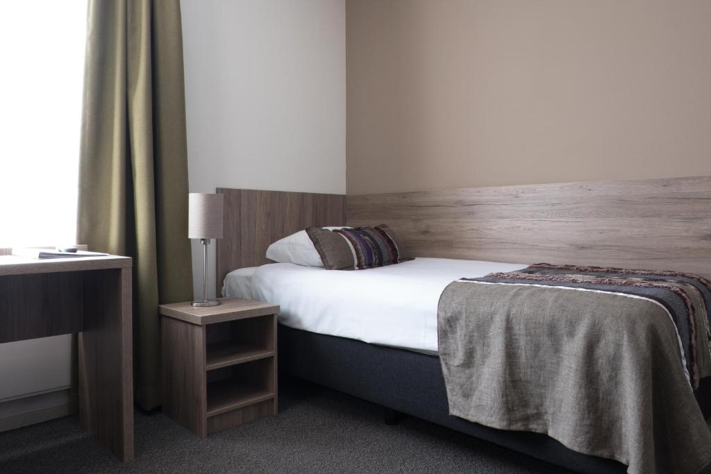 Postel nebo postele na pokoji v ubytování Landgoedhotel Woodbrooke Barchem