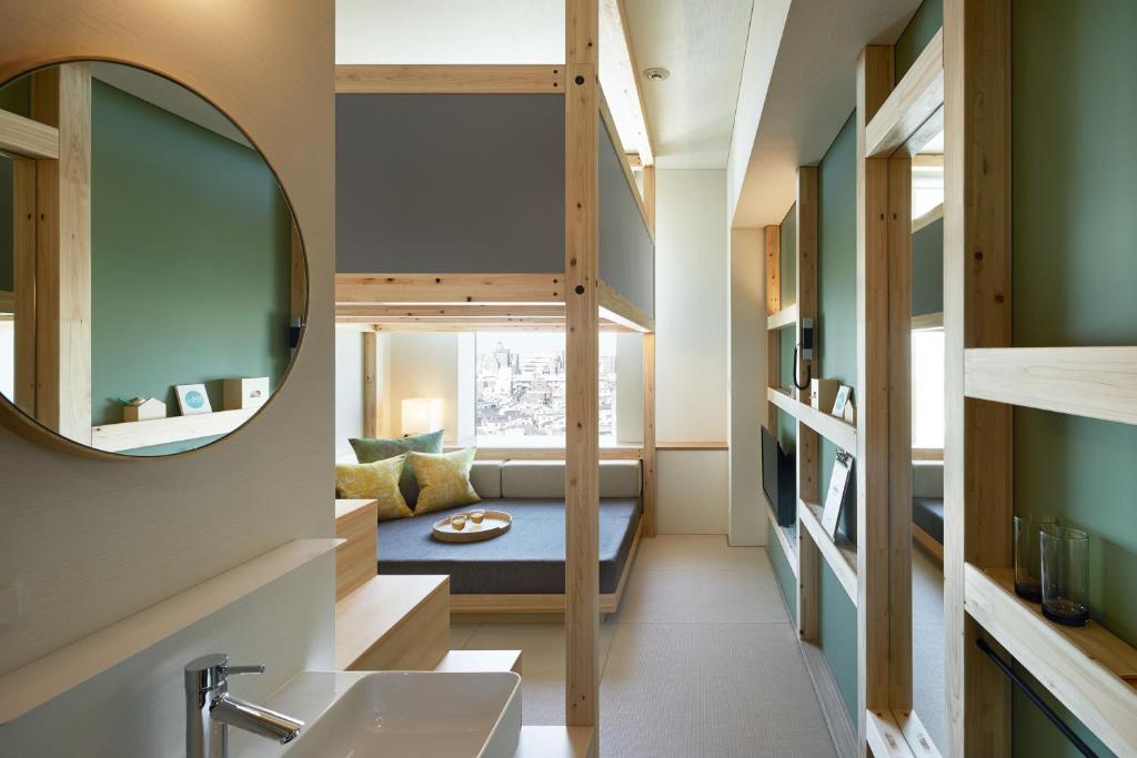 a bathroom with a bunk bed and a mirror at OMO5 Tokyo Otsuka by Hoshino Resorts in Tokyo