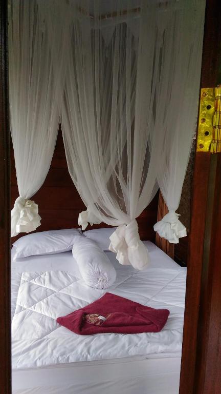 Postel nebo postele na pokoji v ubytování Bali Jungle Resort