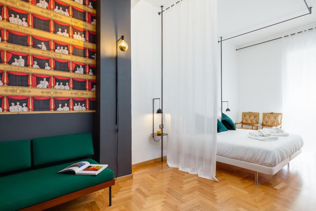 A bed or beds in a room at ALMA de Toledo Design Home Plebiscito