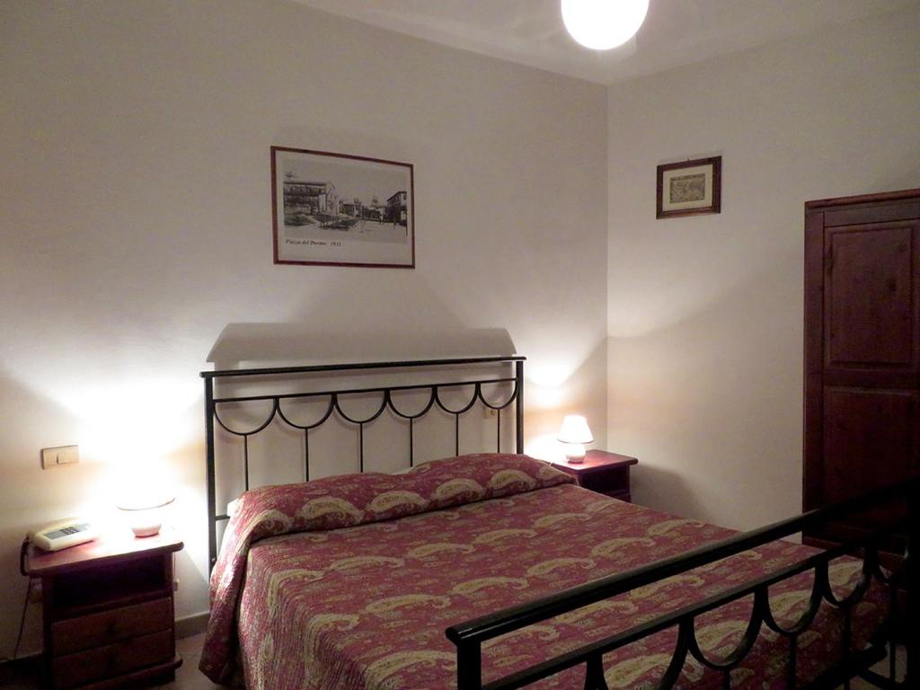 Postel nebo postele na pokoji v ubytování Albergo La Perla