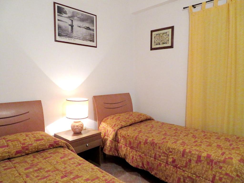 Postel nebo postele na pokoji v ubytování Albergo La Perla