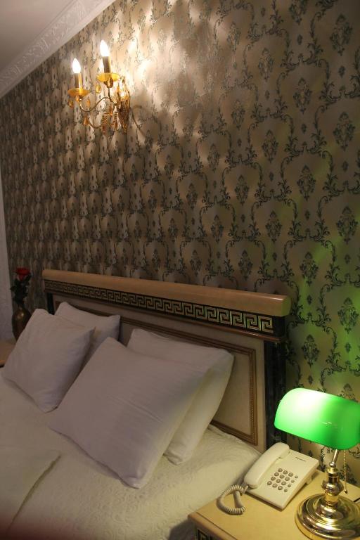 Postel nebo postele na pokoji v ubytování Hotel Adria