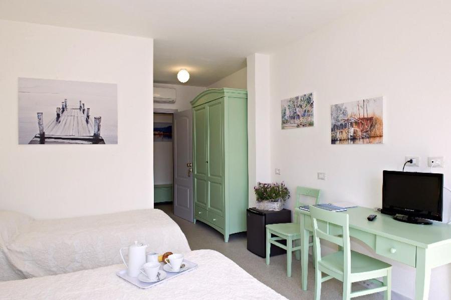 Televízia a/alebo spoločenská miestnosť v ubytovaní LIù B&B