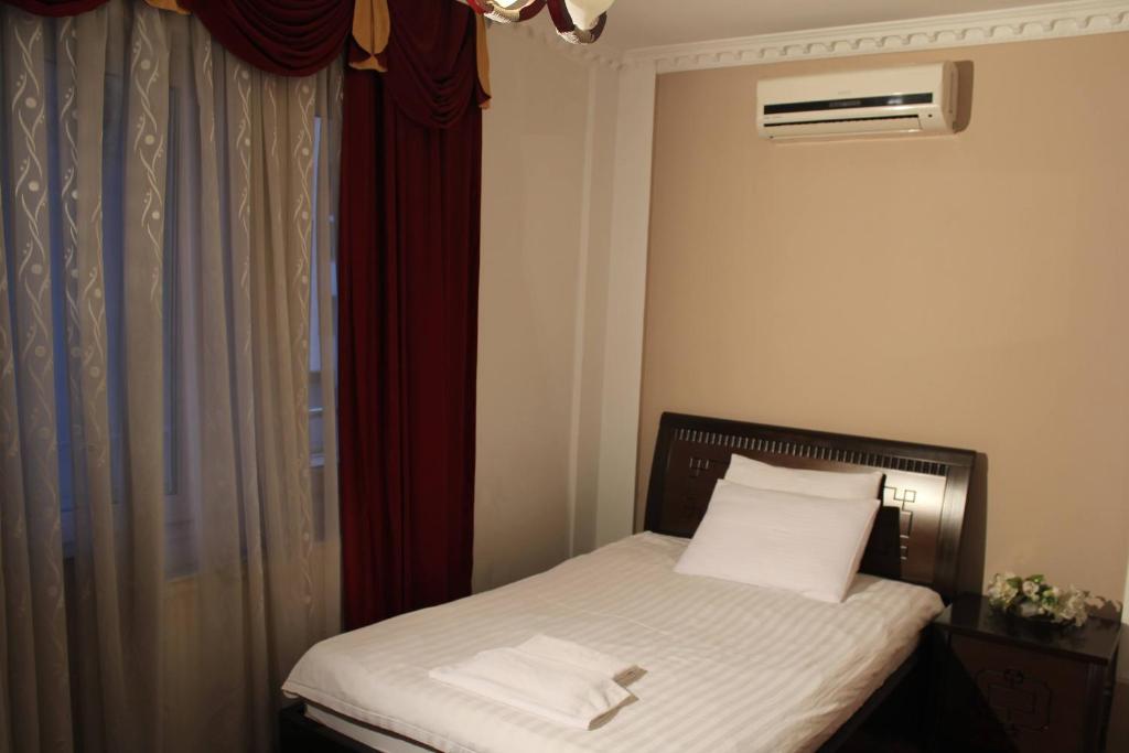 Postel nebo postele na pokoji v ubytování Hotel Adria