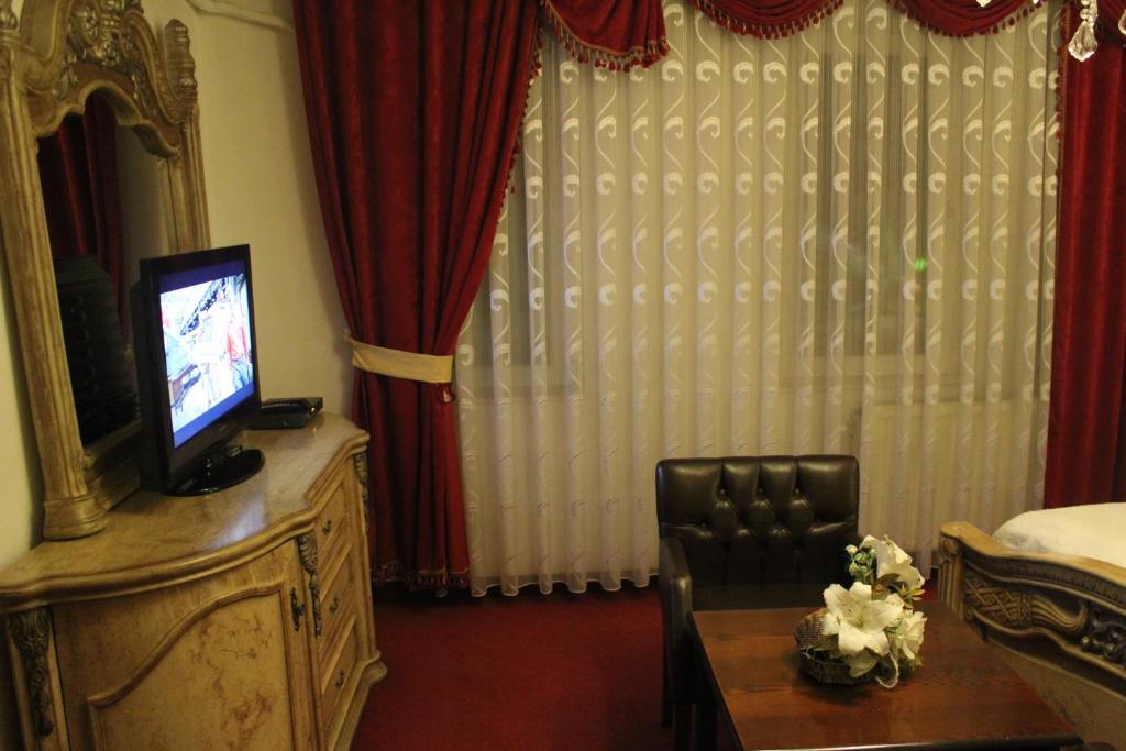 TV a/nebo společenská místnost v ubytování Hotel Adria