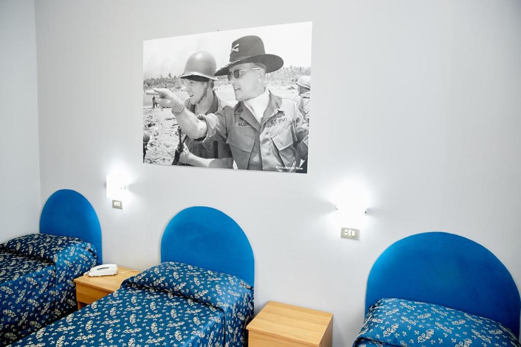 Postel nebo postele na pokoji v ubytování Hotel Ospite Inatteso
