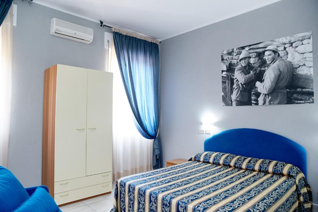 Postel nebo postele na pokoji v ubytování Hotel Ospite Inatteso