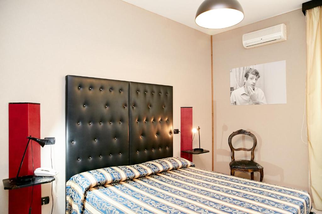 Postel nebo postele na pokoji v ubytování Hotel Ospite Inatteso