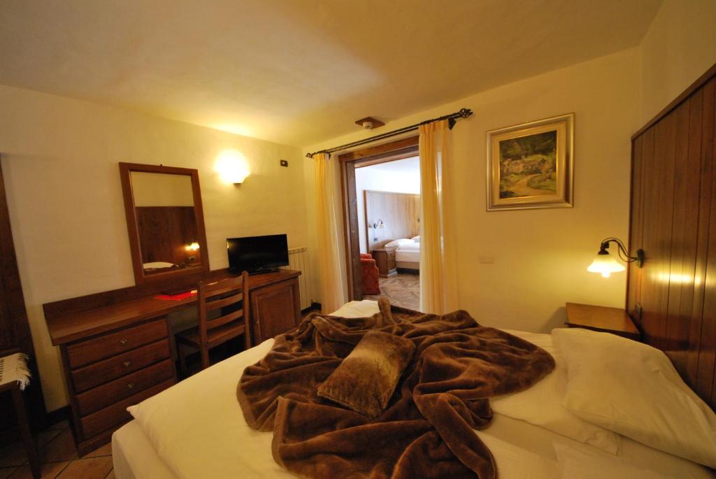 Postel nebo postele na pokoji v ubytování Hotel Bellevue