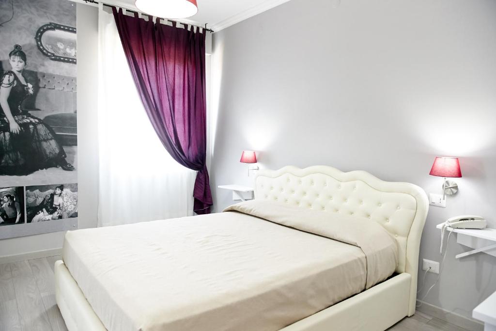 Postel nebo postele na pokoji v ubytování Hotel Ospite Inatteso