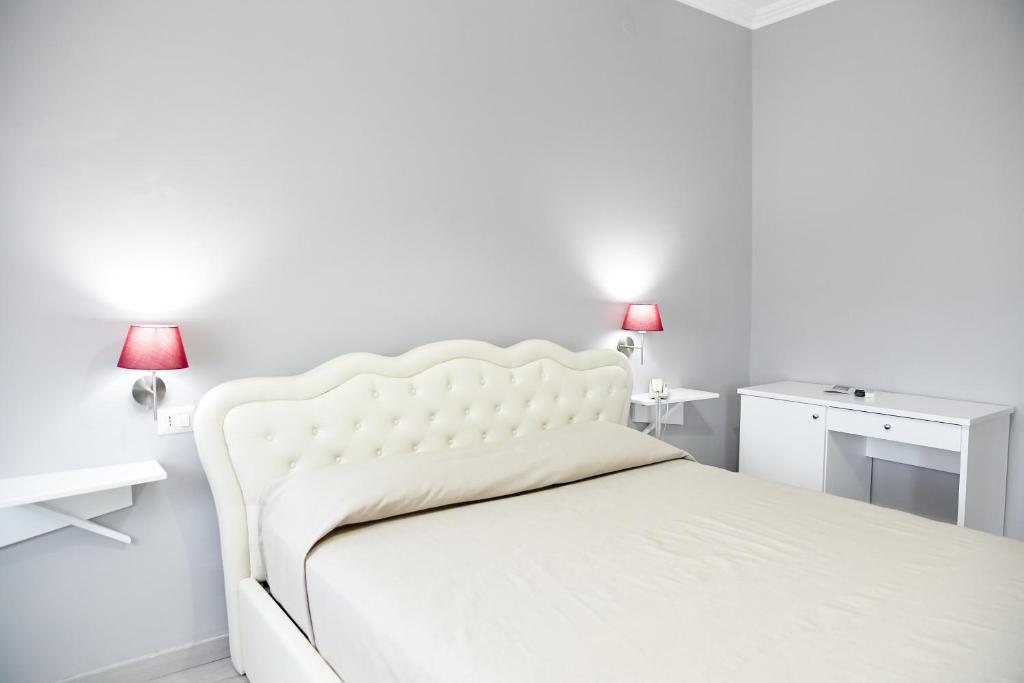 Postel nebo postele na pokoji v ubytování Hotel Ospite Inatteso
