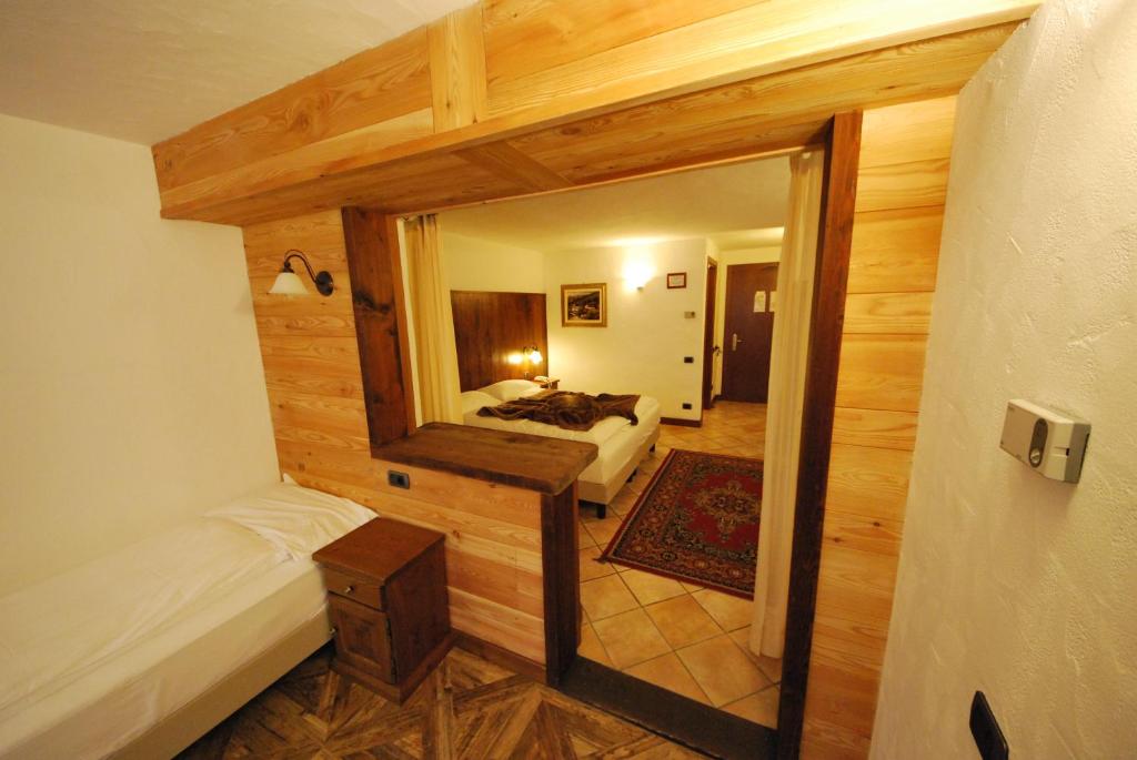Postel nebo postele na pokoji v ubytování Hotel Bellevue