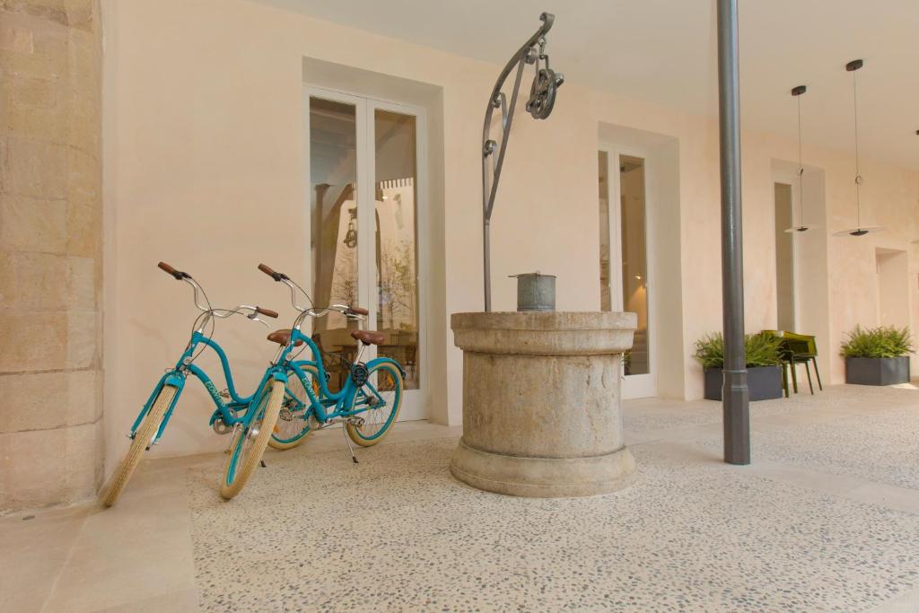 a blue bike parked in front of a building at ICON Rosetó in Palma de Mallorca