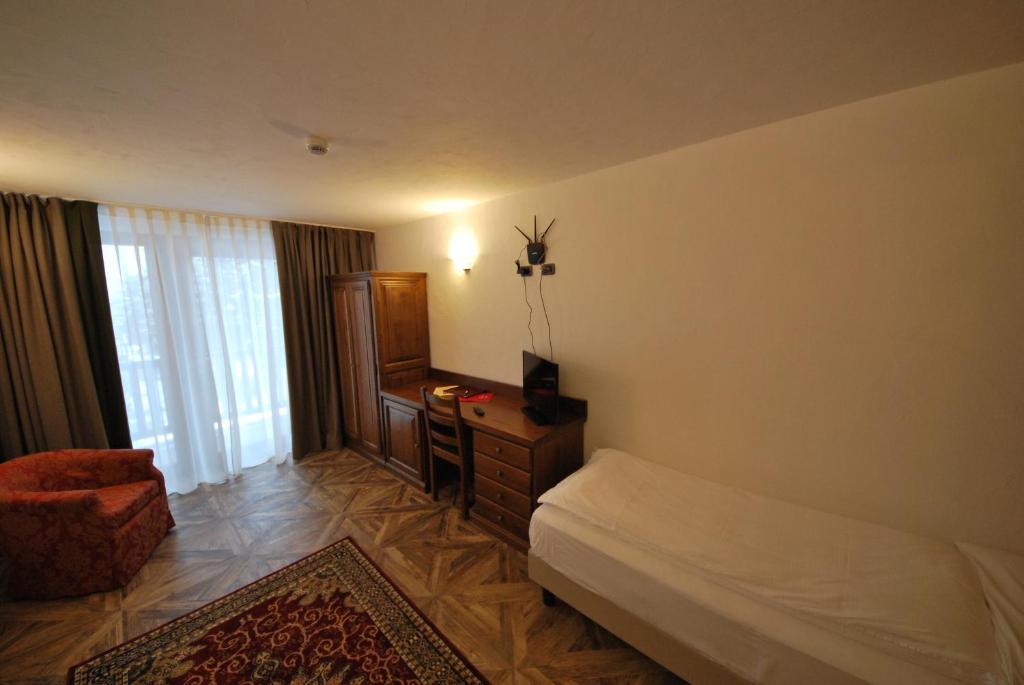 Postel nebo postele na pokoji v ubytování Hotel Bellevue