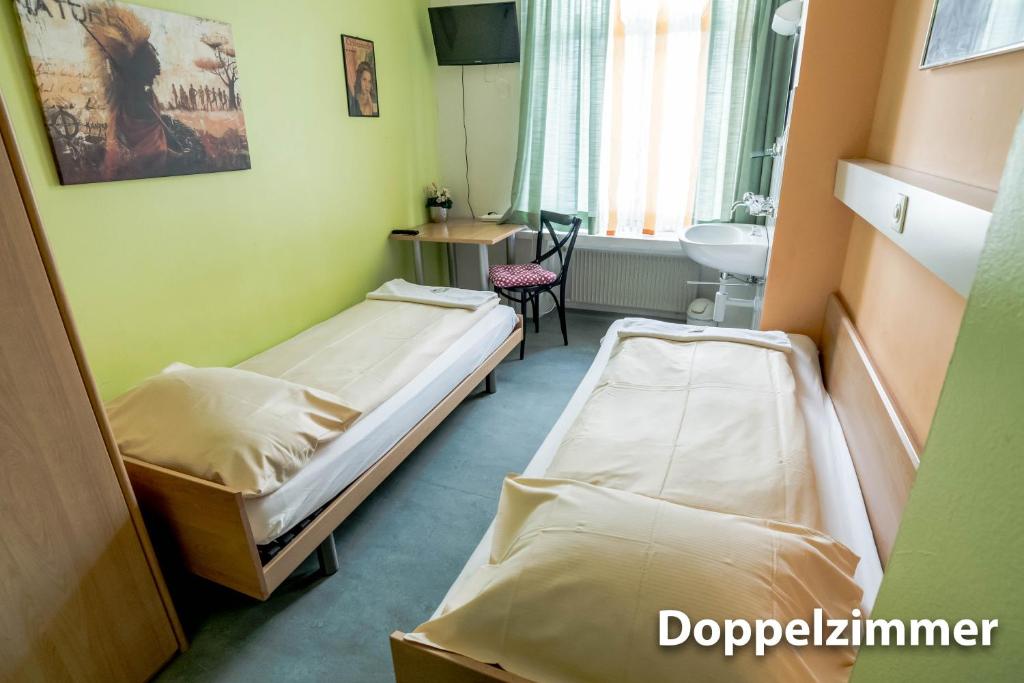 Postel nebo postele na pokoji v ubytování Hotel & Backpackers Zak Schaffhausen