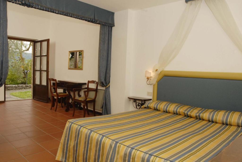 Posteľ alebo postele v izbe v ubytovaní Relais Borgo Di Toiano