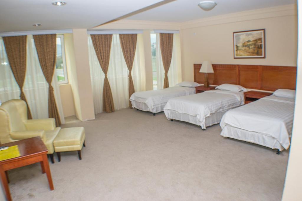 Postel nebo postele na pokoji v ubytování Hotel Feni