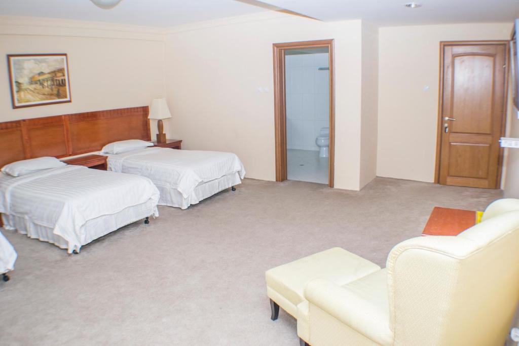 Postel nebo postele na pokoji v ubytování Hotel Feni