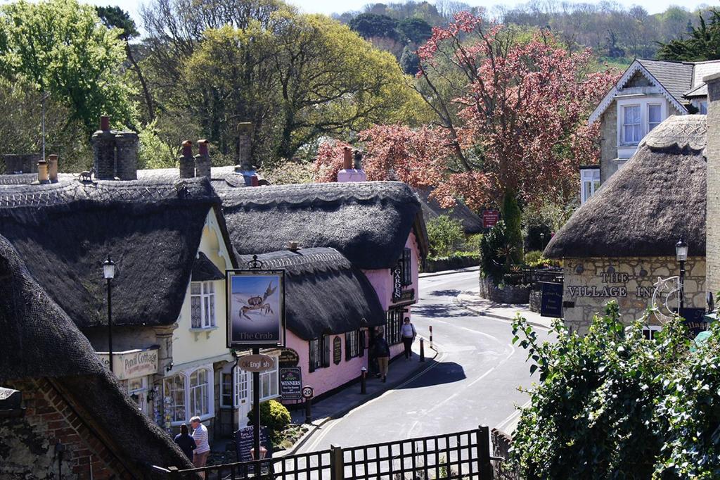an image of a village with thatched roofs at Holliers Hotel in Shanklin