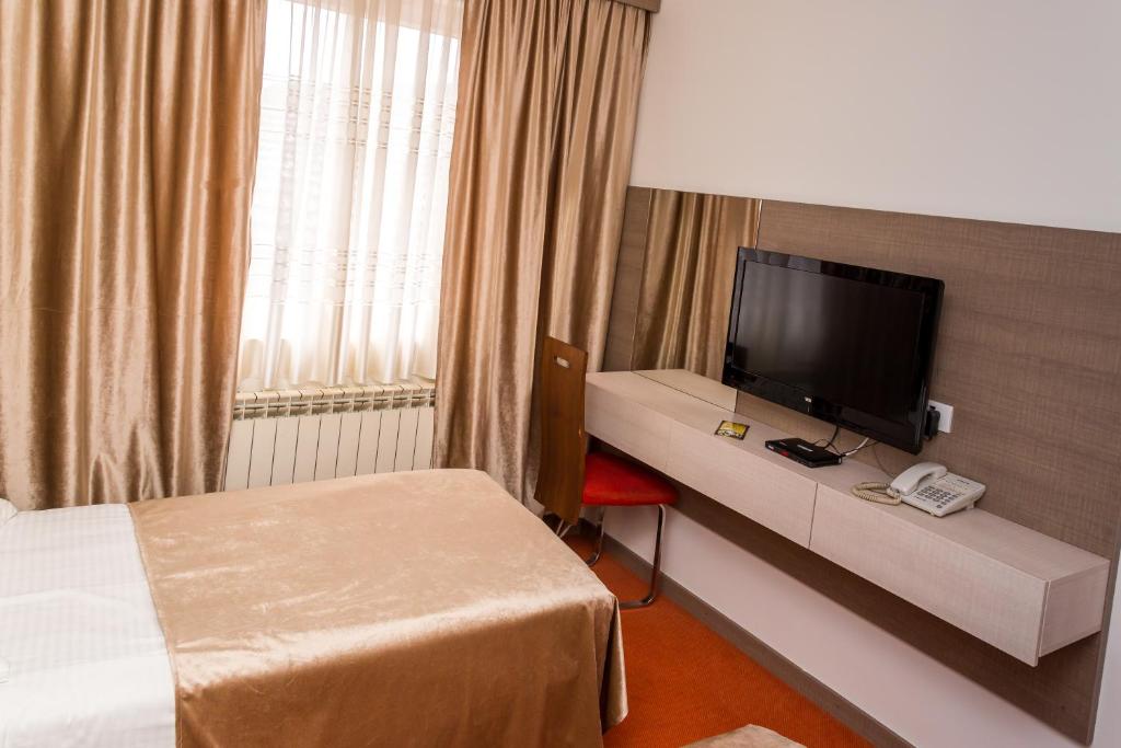 Postel nebo postele na pokoji v ubytování Hotel S