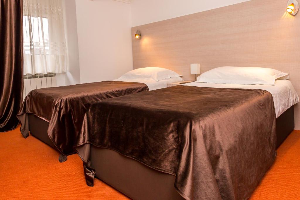 Postel nebo postele na pokoji v ubytování Hotel S