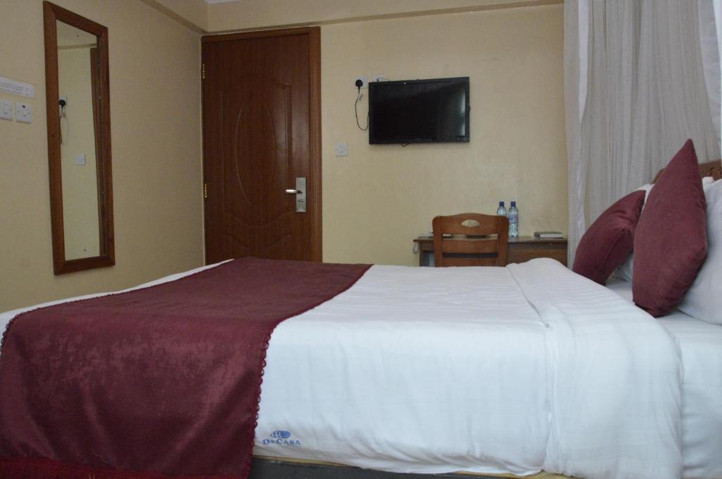 Postel nebo postele na pokoji v ubytování Decasa Hotel