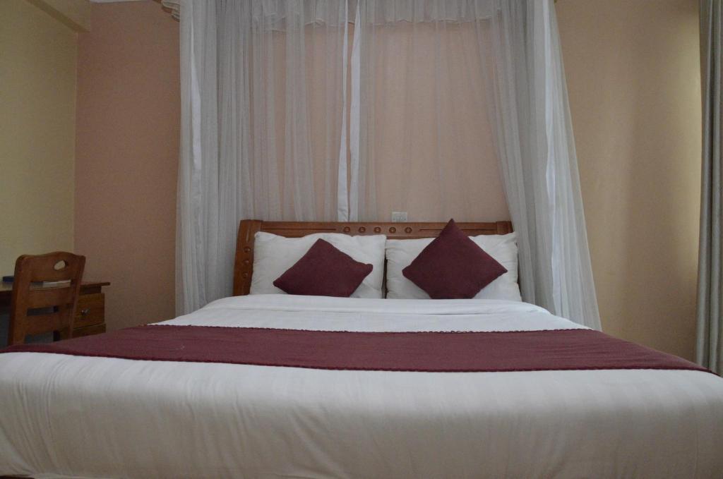 Postel nebo postele na pokoji v ubytování Decasa Hotel