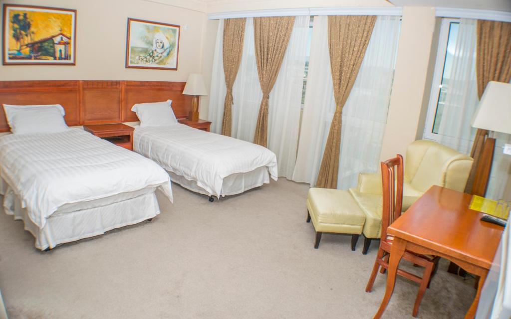 Postel nebo postele na pokoji v ubytování Hotel Feni