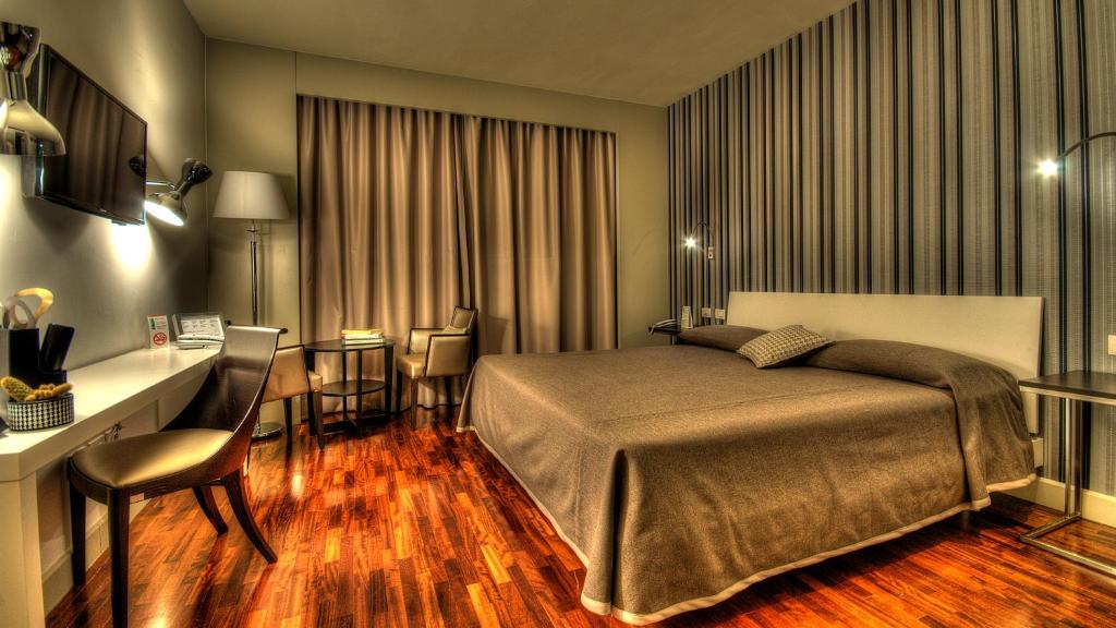 Posteľ alebo postele v izbe v ubytovaní Hotel Datini
