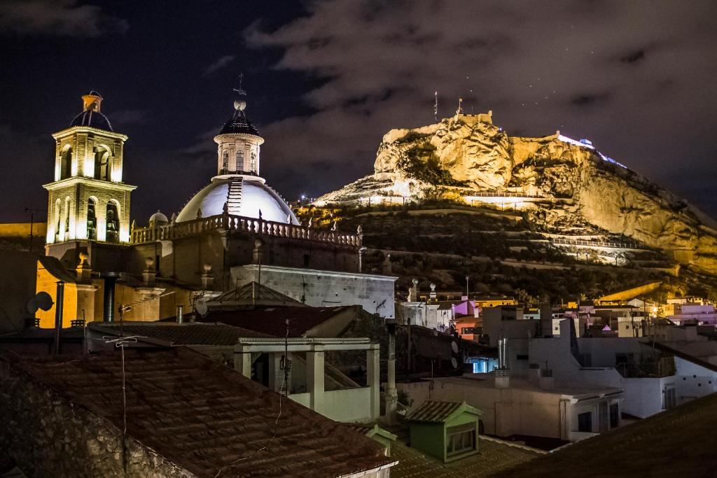 a church and a mountain at night at Hospes Amérigo, Alicante, a Member of Design Hotels in Alicante