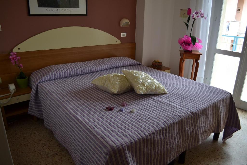 Postel nebo postele na pokoji v ubytování Hotel Jasmine Beach