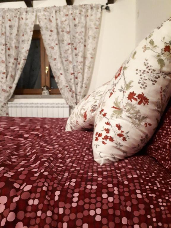 Postel nebo postele na pokoji v ubytování La Camelia B&B