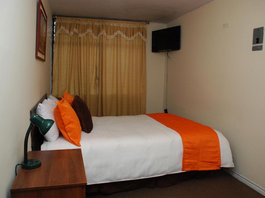 Postel nebo postele na pokoji v ubytování Hotel Bonaventure