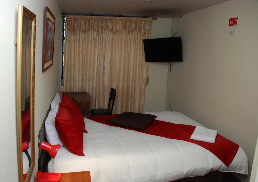 Postel nebo postele na pokoji v ubytování Hotel Bonaventure