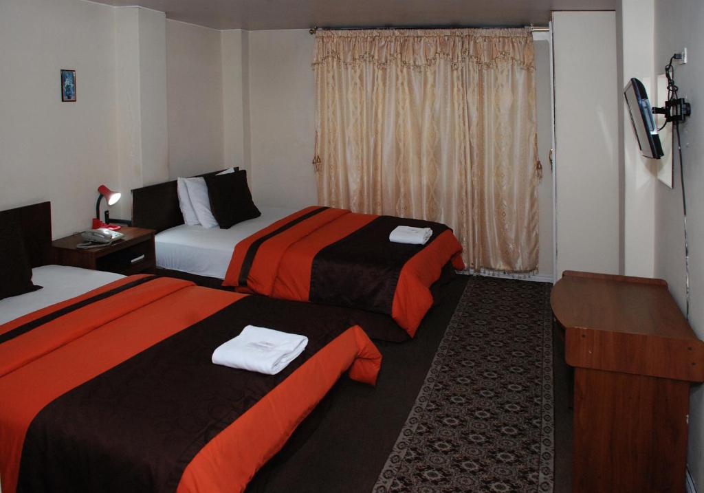 Postel nebo postele na pokoji v ubytování Hotel Bonaventure