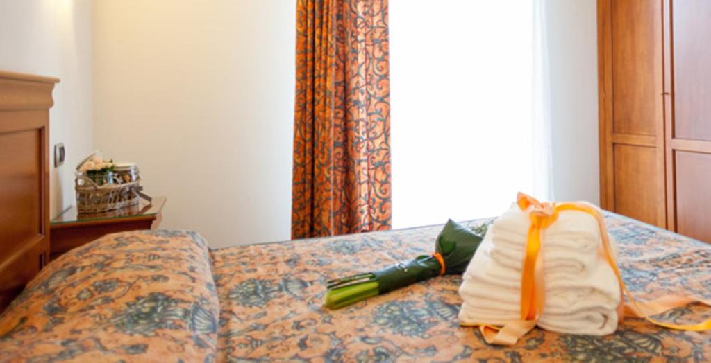 Postel nebo postele na pokoji v ubytování Hotel Bologna