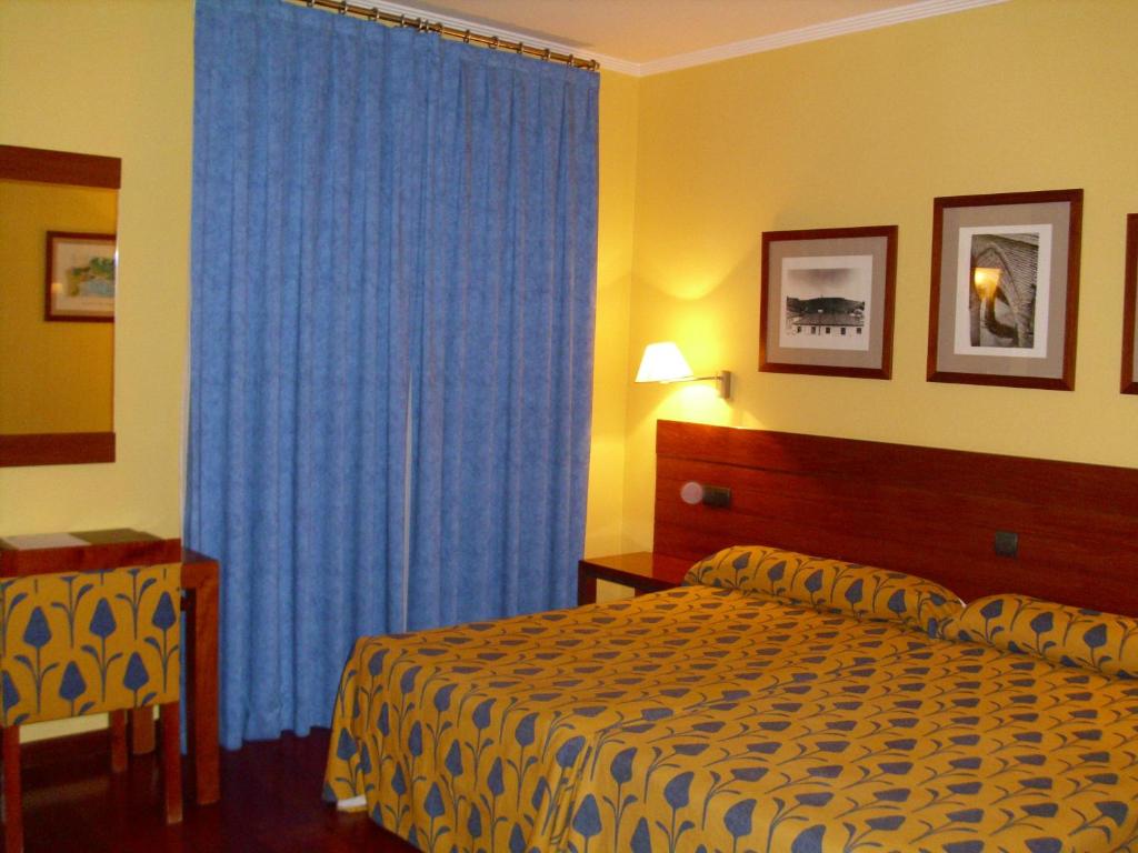 Postel nebo postele na pokoji v ubytování Hotel Rural Vado del Duratón