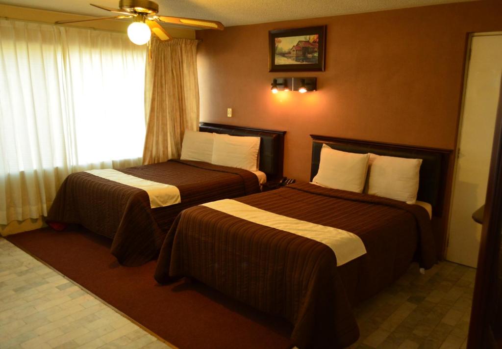 Postel nebo postele na pokoji v ubytování Hotel Flamingo Kristal