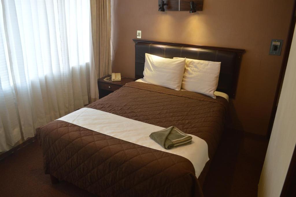 Postel nebo postele na pokoji v ubytování Hotel Flamingo Kristal