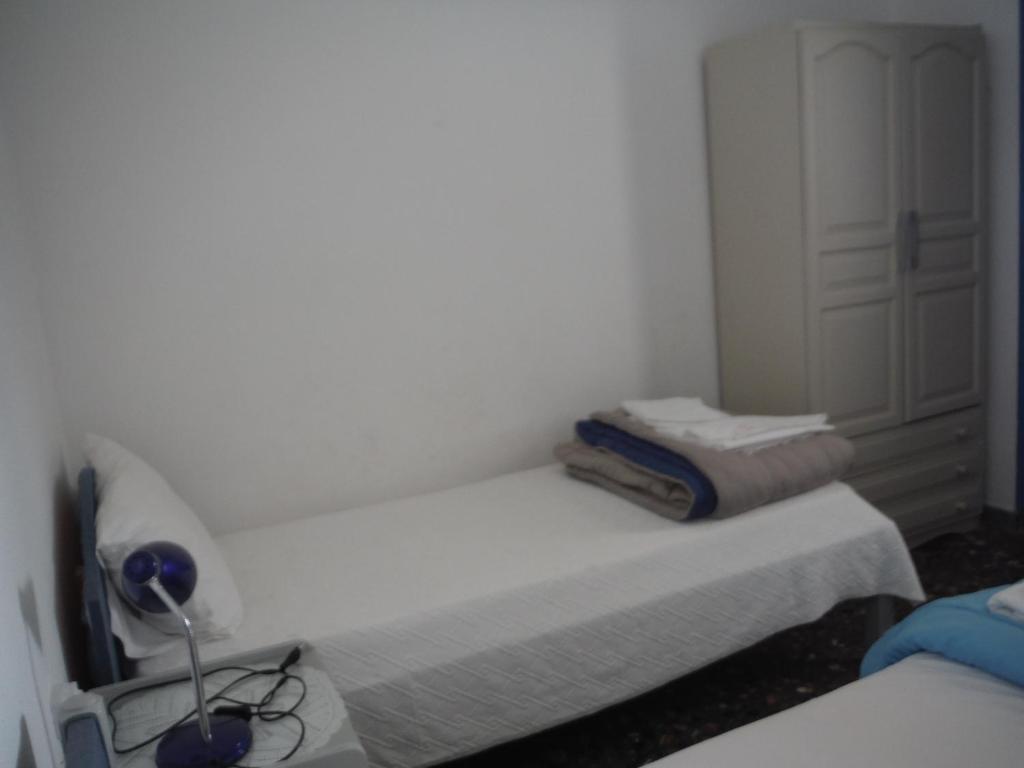 Posteľ alebo postele v izbe v ubytovaní Tasomanolis Studios